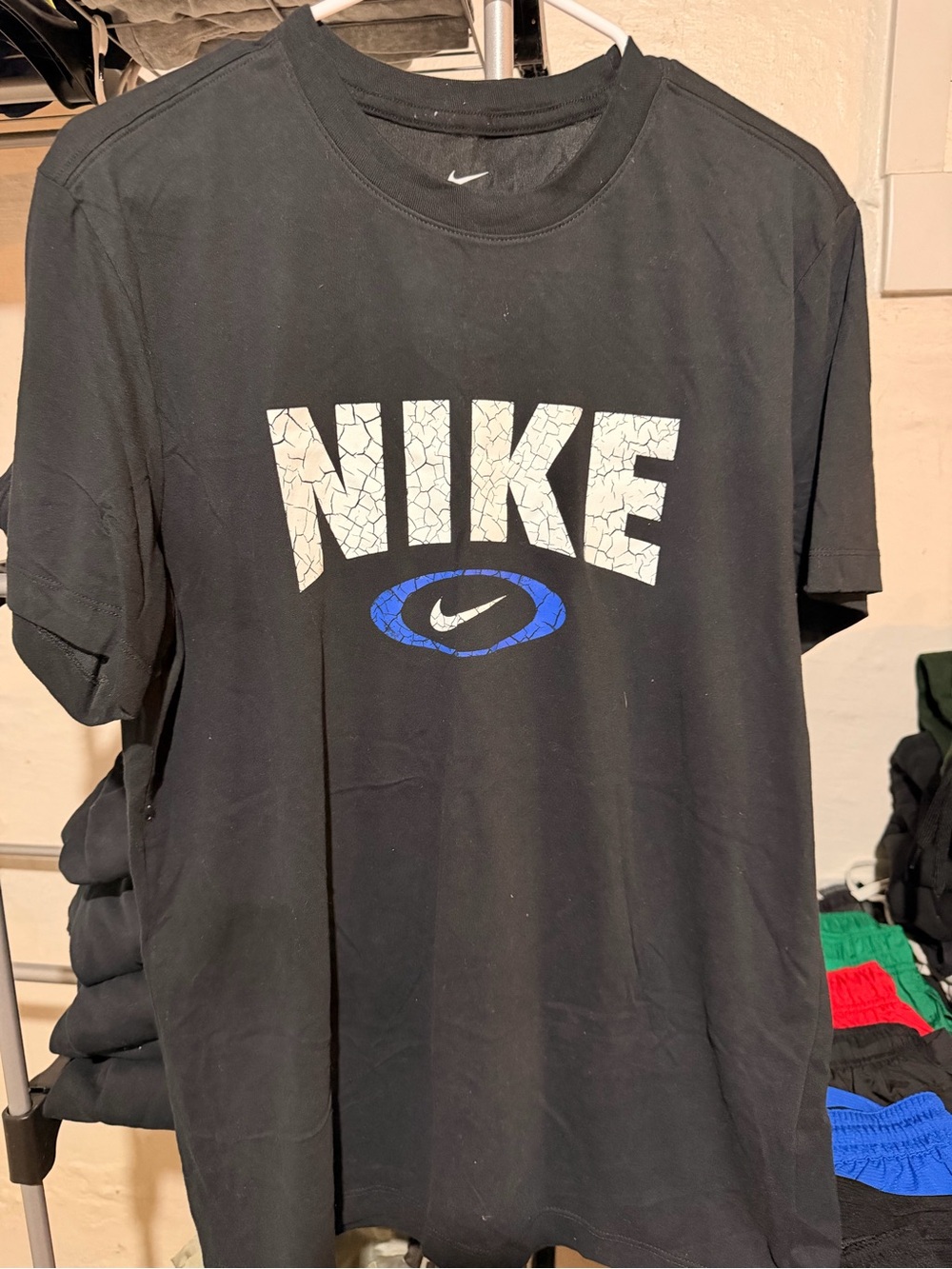 Nike Black Short Sleeve Tee with White Cracked Logo and Blue Accent